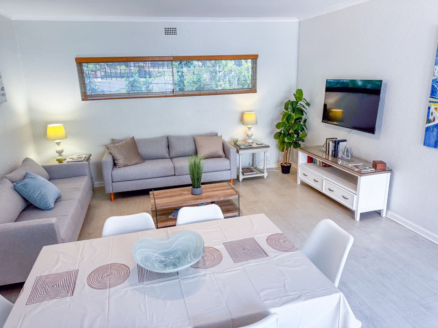 Living and dining area in the Green Point apartment